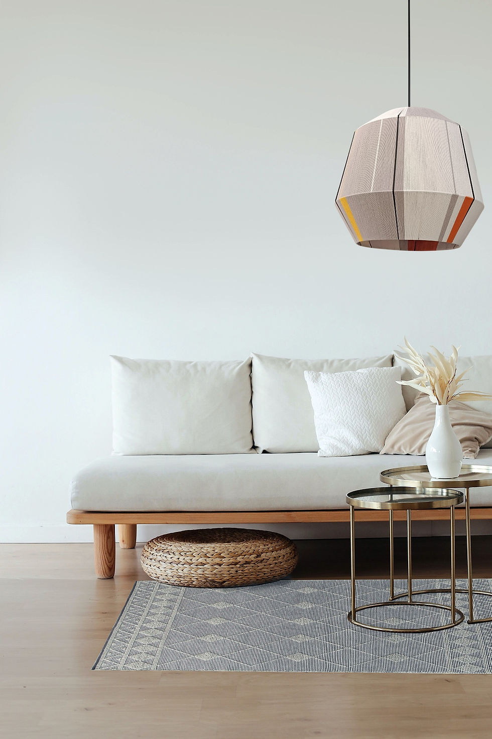 Thumbnail: Gold-striped pendant lamp hanging above white sofa