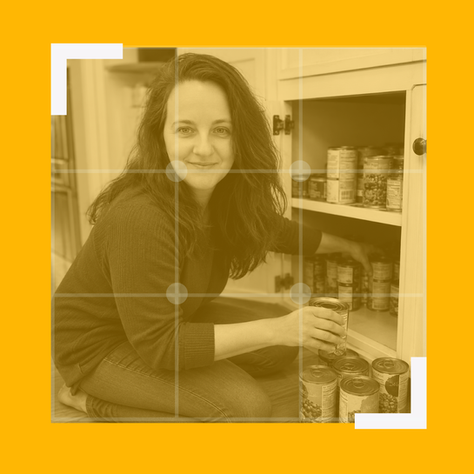 Cindy from Mrs Prime organising tins on the bottom shelf of a kitchen cupboard, representing Amazon backend keywords as hidden listing content that sellers often forget to check.