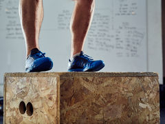 A athlete performing a box jump to improve athletic power. 