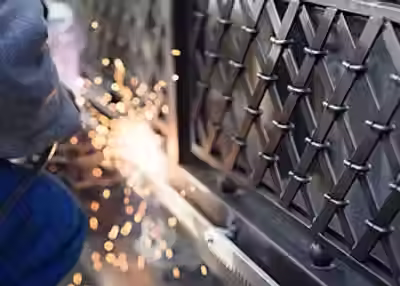 metal-gate-grinding-sparks.avif