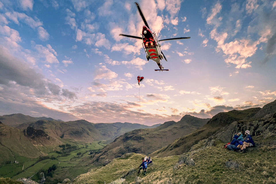 Casualty being winched into a helicopter