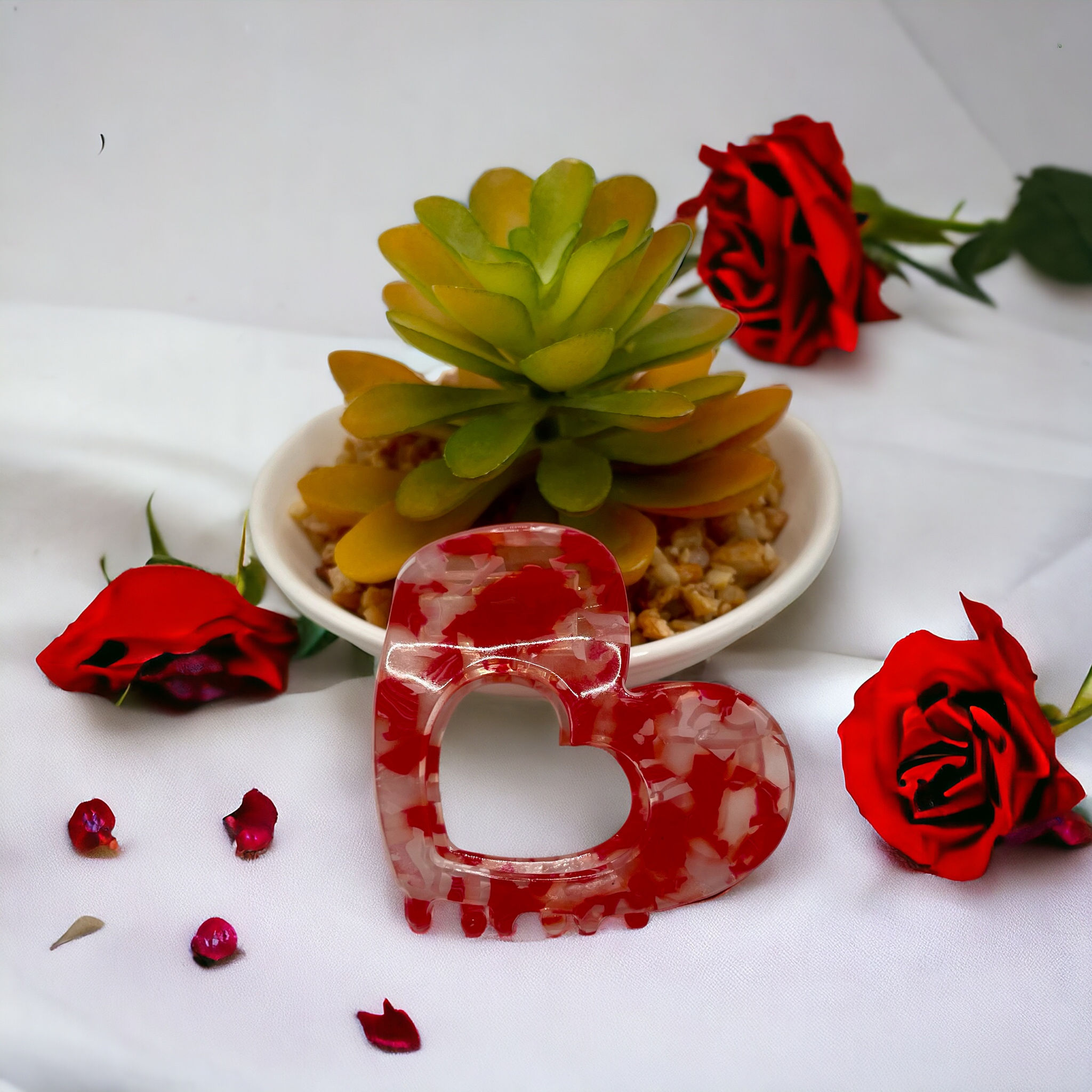 Elegant red and white heart-shaped hair claw clip crafted from exquisite acrylic for a touch of sophistication and glamour.