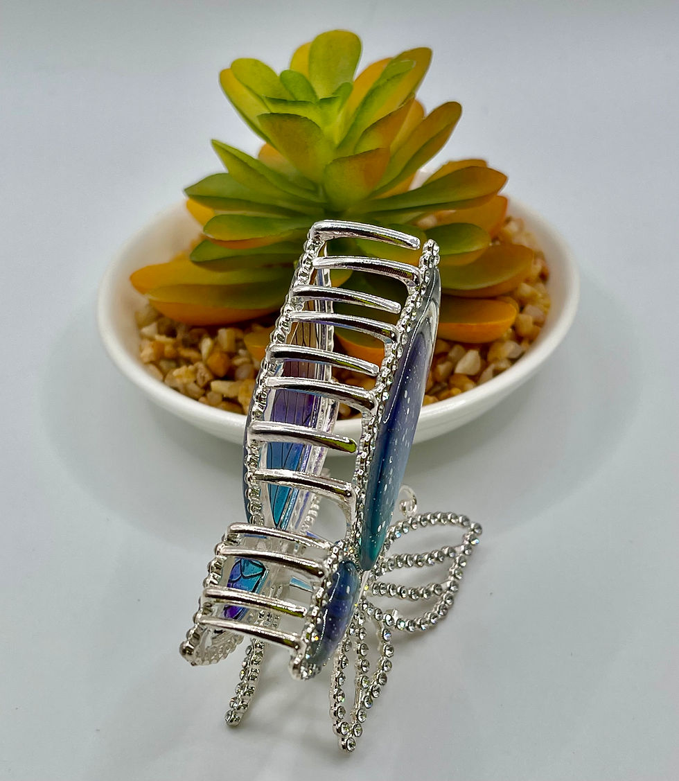 Thumbnail: A close-up of an Elegant Stained Glass Butterfly Design Claw Clip in shimmering gold.
