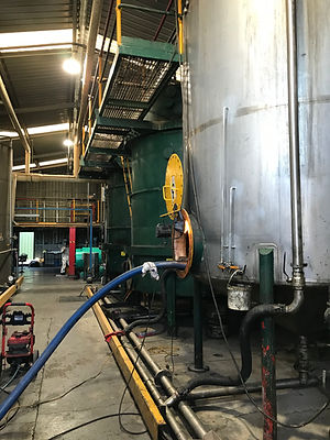 Cleaning Oil Refining Tanks.JPG