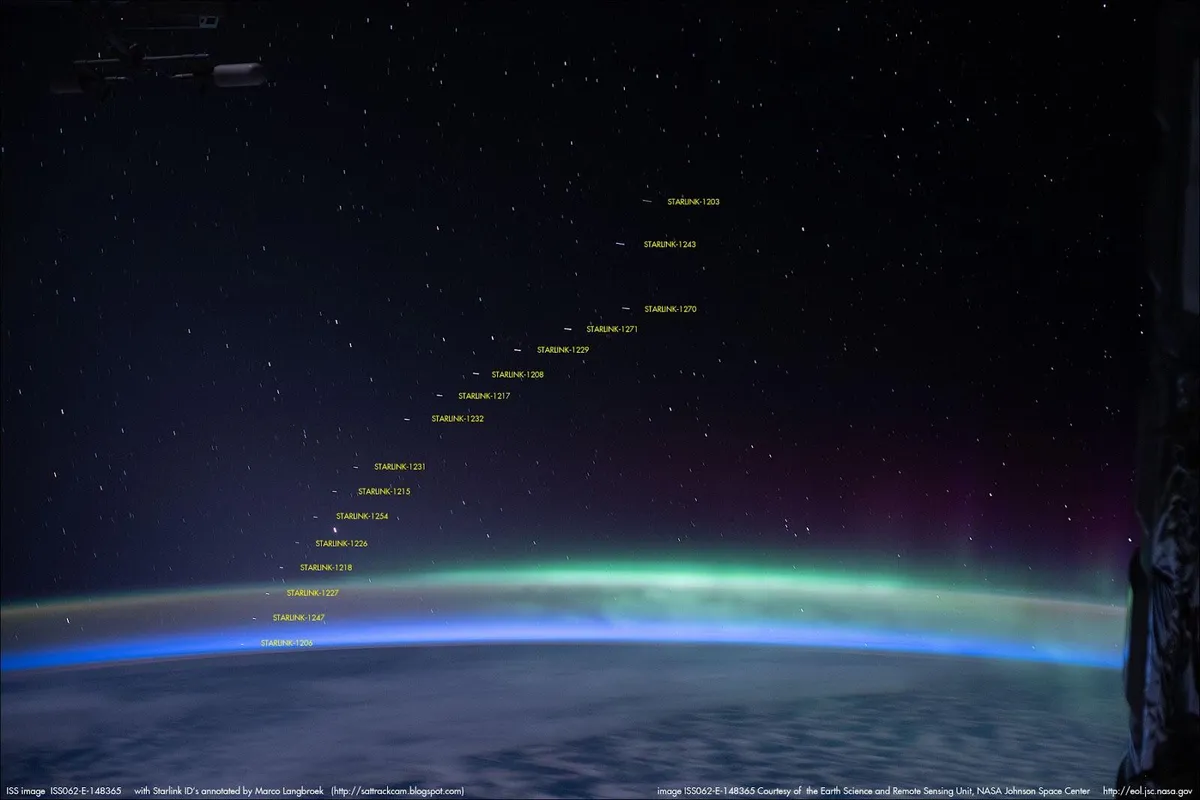 Aurora australis and trails of SpaceX satellites