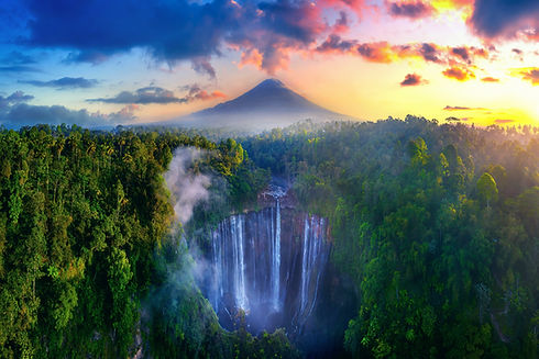 Tumpak Sewu Waterfall and Semeru mountain at sunrise, Indonesia.jpg