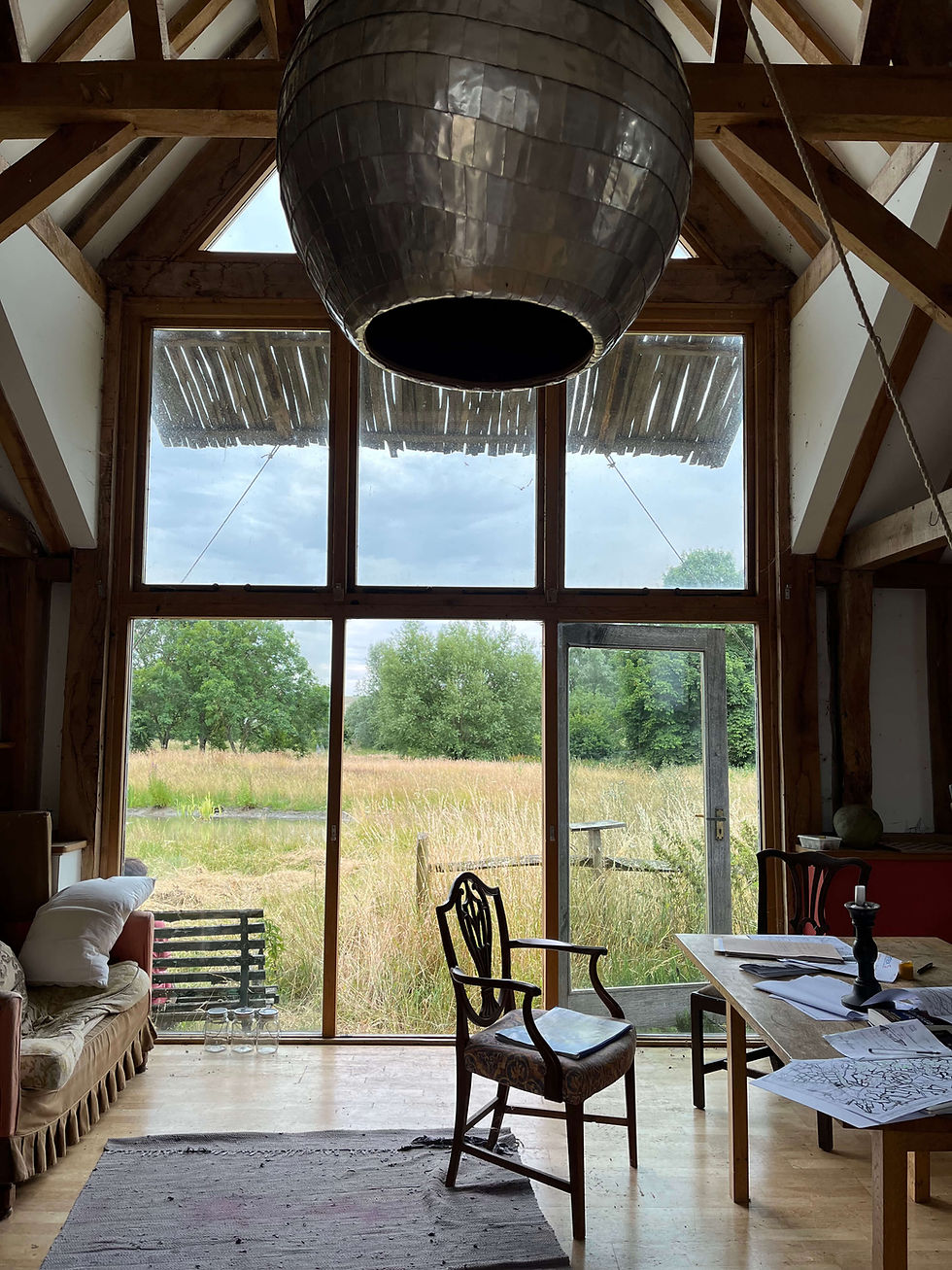 Types of SuDS sustainable drainage features explained: permeable paving allowing water infiltration car parks driveways paths with sub-base design, vegetated swales shallow channels conveying storing water dry swales wet swales gradient dependent, rain gardens bioretention areas landscaped depressions reducing runoff treating pollution tree planting integration, green roofs vegetation covering extensive shallow lightweight intensive roof gardens trees dense urban areas, attenuation basins detention ponds storing water temporarily permanently, soakaways infiltration trenches percolating groundwater suitable ground conditions avoiding clay soils for UK development surface water management