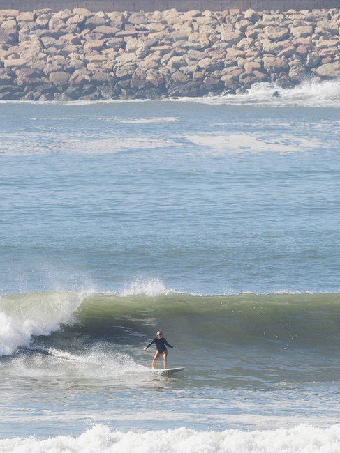 Surfer finding flow on a wave in Mirleft, reflecting what surfing teaches about patience and letting go.