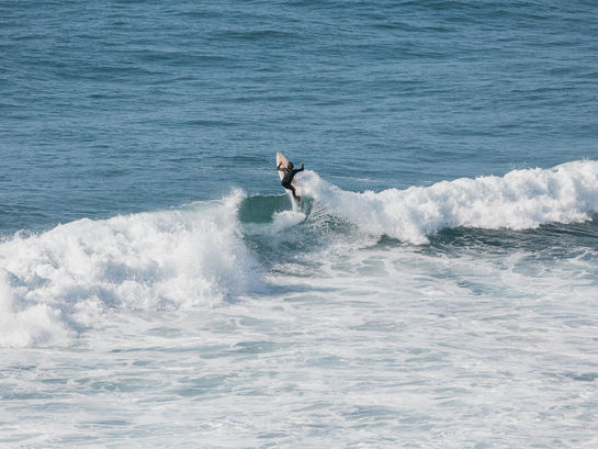 Experienced surfer riding a wave on Morocco's Atlantic coast