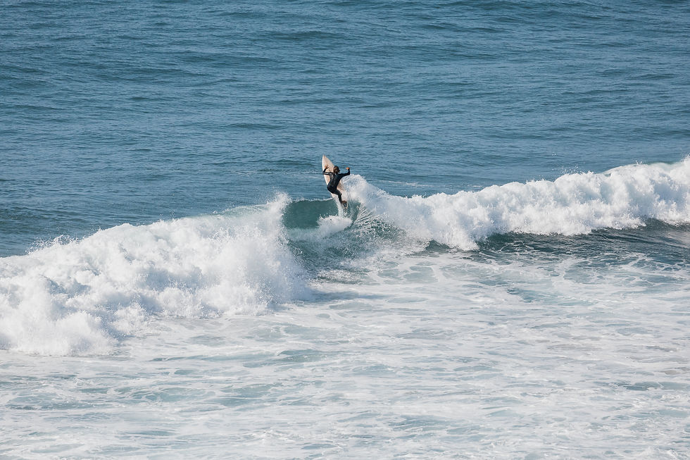 Experienced surfer riding a wave on Morocco's Atlantic coast