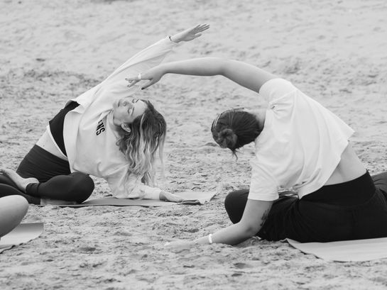 Yoga for surfers on the beach in Morocco, supporting mobility, recovery, and overall surf performance