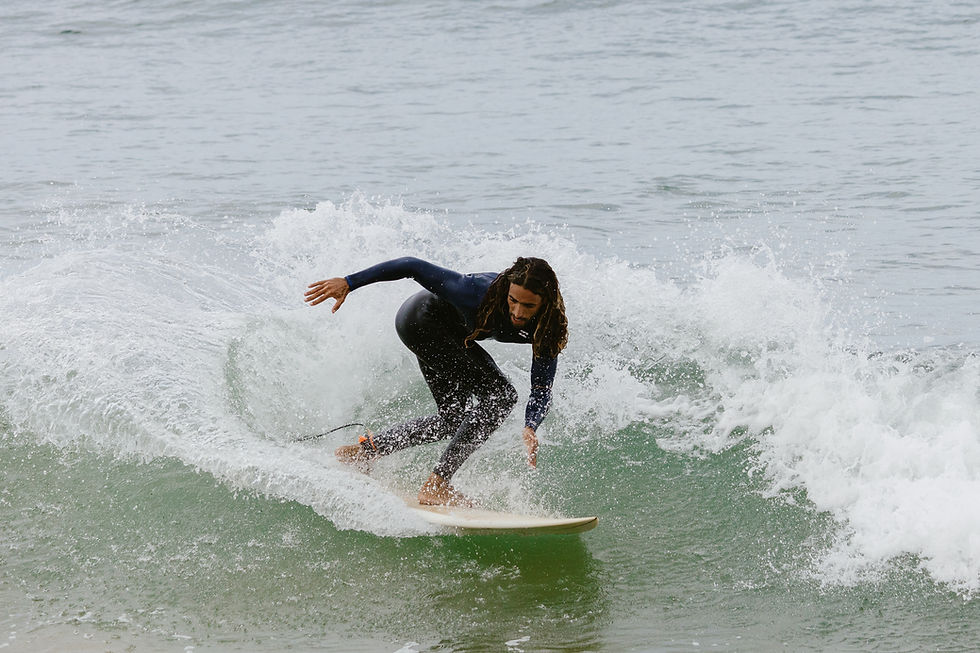 Surfer riding a wave in Mirleft, Morocco