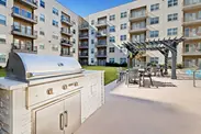 Outdoor seating and grills by swimming pool