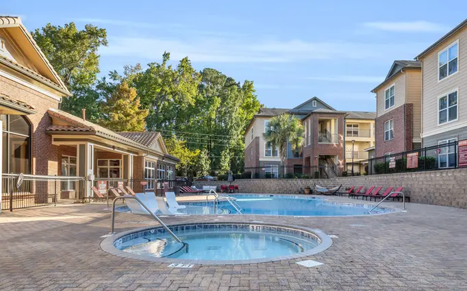 Sundeck and resort style swimming pool with Jacuzzi