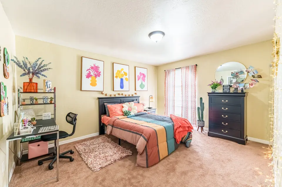 Student Bedroom w/ desk & full-sized bed.