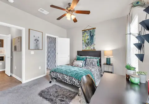 Full-sized bed in fully furnished bedroom - Apartments Near Coastal Carolina University