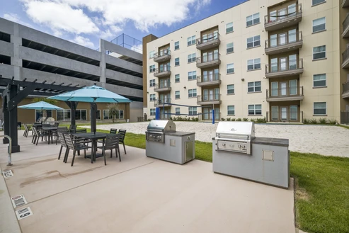 Outdoor grilling station by swimming pool