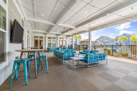 Outdoor seating between our clubhouse and pool