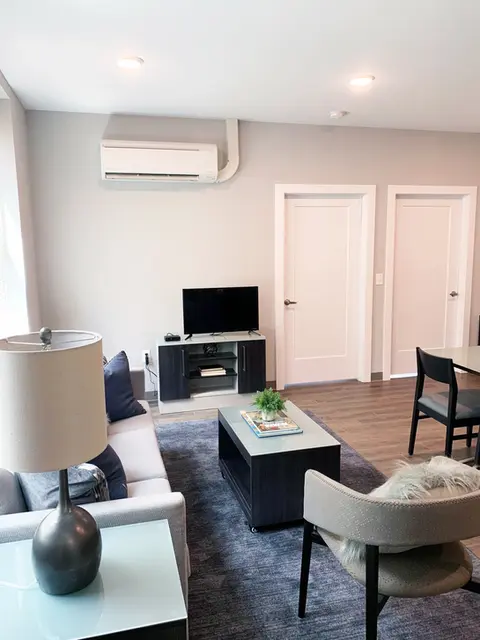 Fully-Furnished Living Room with Flat Screen TV