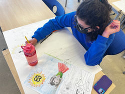 Student working on artwork for exhibit