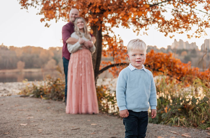 child with family during a fall family photography session in Vancouver British columbia