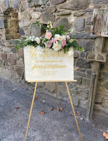 white and gold acrylic welcome sign