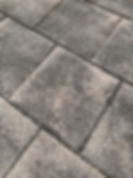 An example of dirty pavers with destabilized joints
