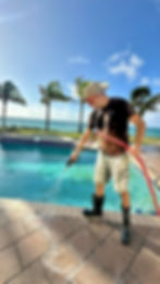 Applying a soft wash pre-treatment to dirty pavers