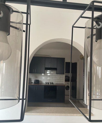 A view from the dining area into the kitchen