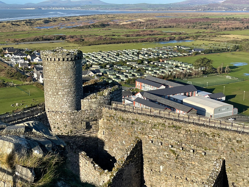View from Harlech Castle tower overlooking nearby caravan park and surrounding landscape
