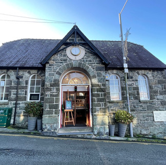 Independent shops, cafes, and local businesses clustered around Harlech Castle