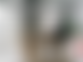 Buyer reviewing a rent-to-own agreement in a modern Estonian home after being excluded from a traditional mortgage.