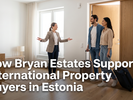 Bryan Estates team member welcoming international couple at bright modern Tallinn apartment door