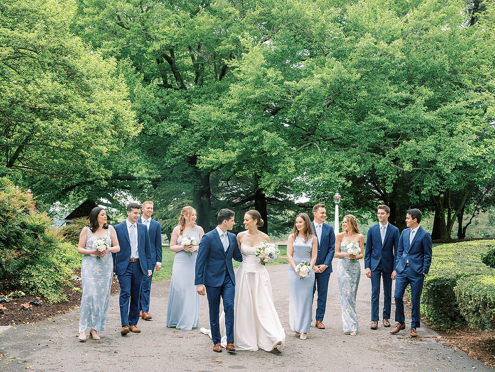 Wedding party walking down the Brittland Manor lane for photos.