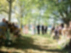 Outdoor wedding ceremony among the trees at Brittland Manor