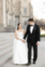 bride and groom holding hands while walking