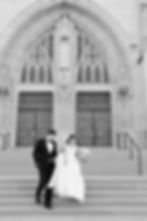bride and groom walking down steps