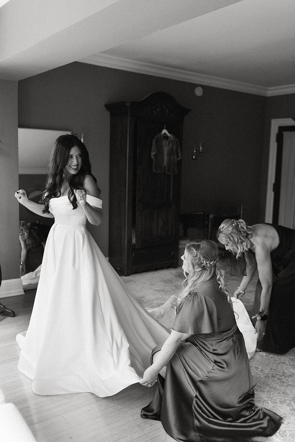Bride getting into dress