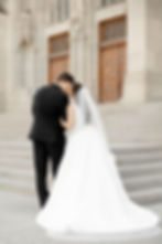 Bride and groom on stairs at Scottish Rite Cathedral