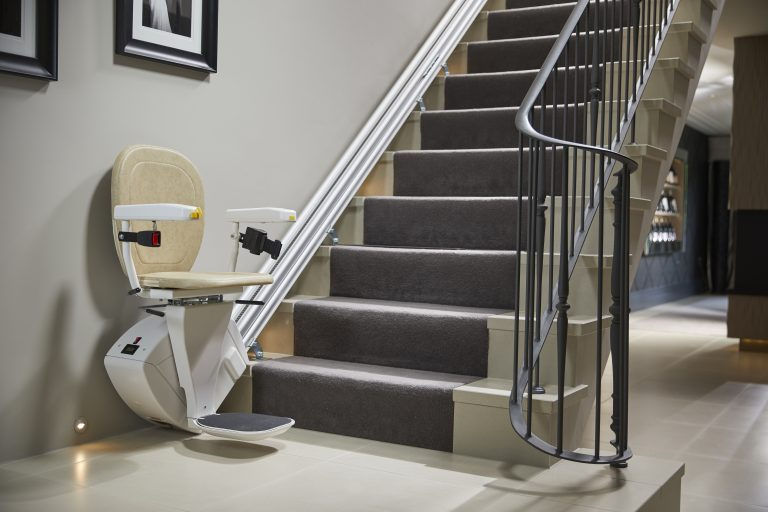 Straight stair lift system installed along residential staircase for safe and independent home acces