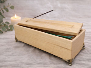 “Handcrafted wooden incense box used in a sacred meditation space setup, supporting calm, grounding, and spiritual rituals at home.”