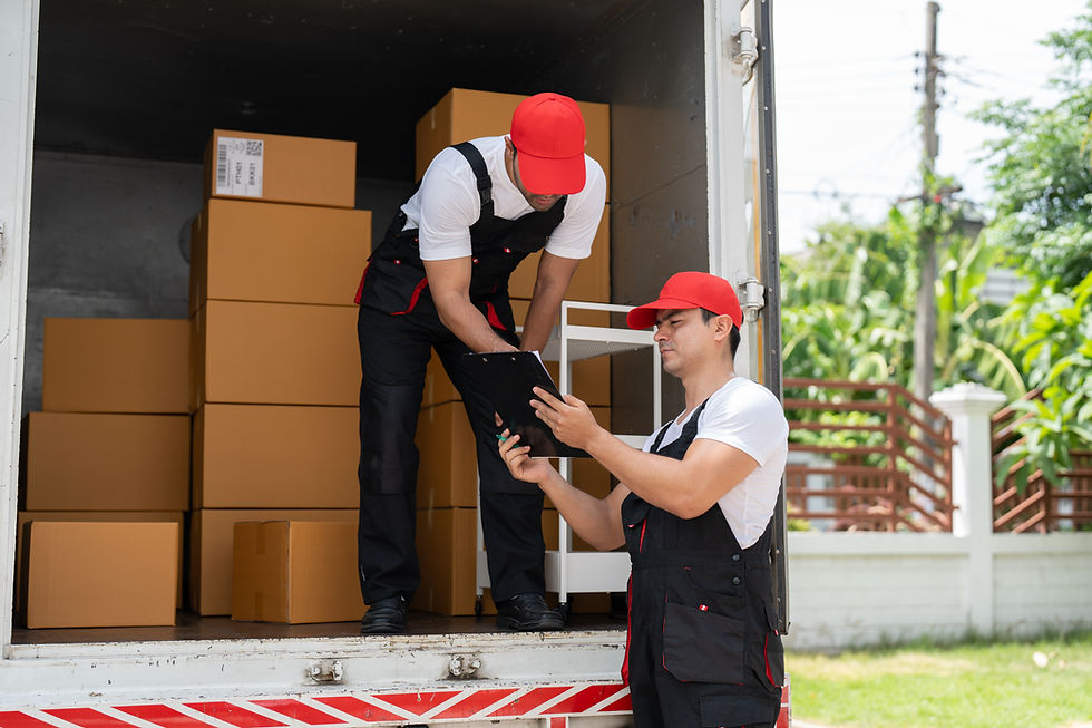 man-mover-worker-checking-lists-clipboard-while-unloading-cardboard-boxes-from-truck.jpg