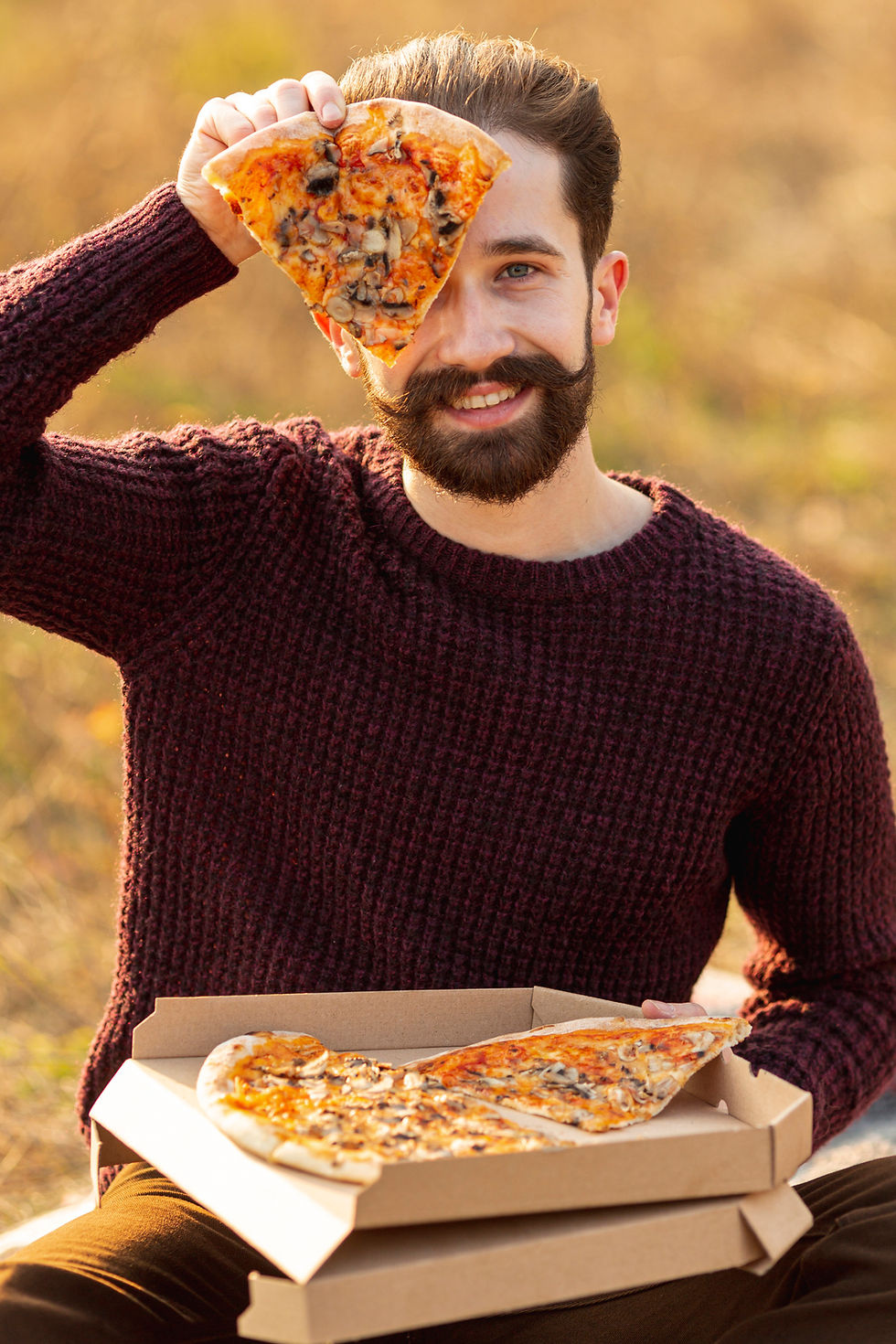 handsome-man-showing-slice-pizza.jpg