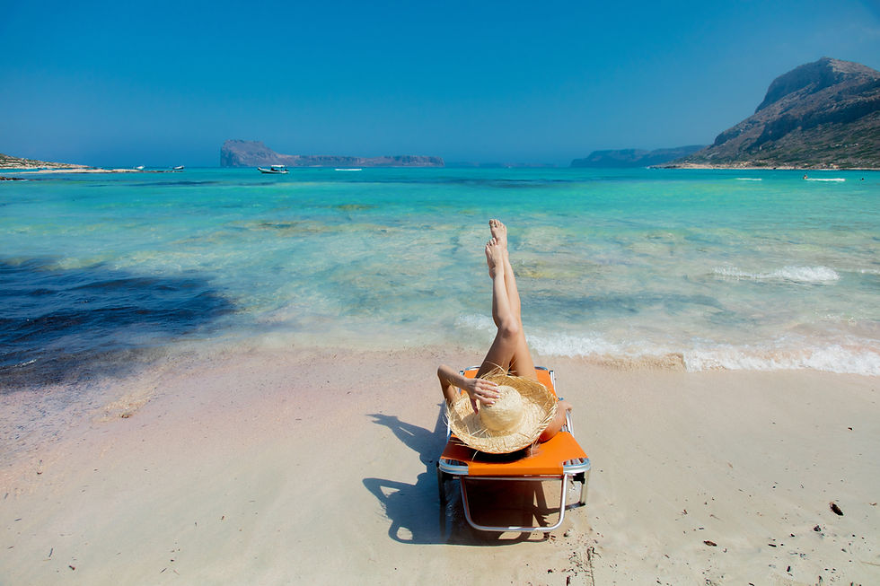 girl-lying-down-lounger-balos-beach.jpg