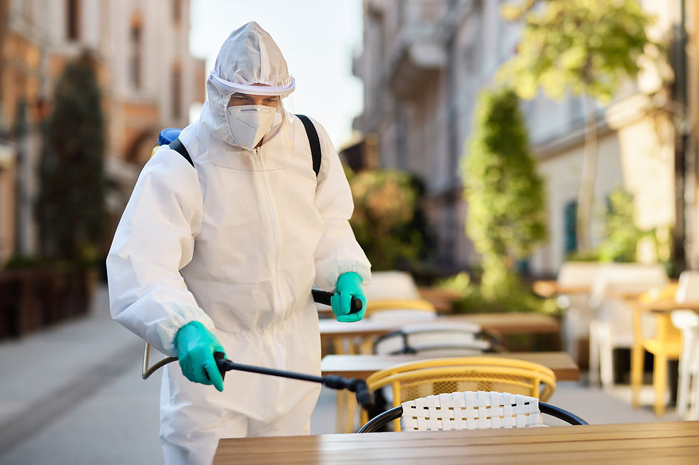 healthcare-worker-hazmat-suit-disinfecting-sidewalk-cafe-covid19-epidemic.jpg