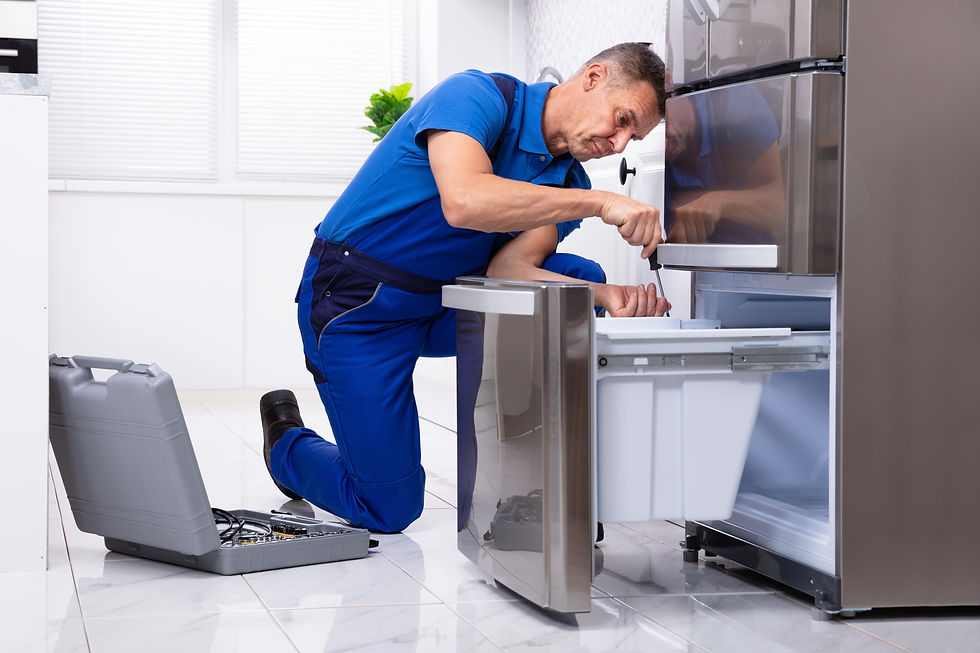 serviceman-repairing-refrigerator.jpg