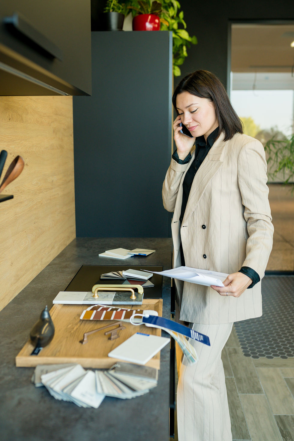young-woman-using-mobile-phone-while-standing-table.jpg