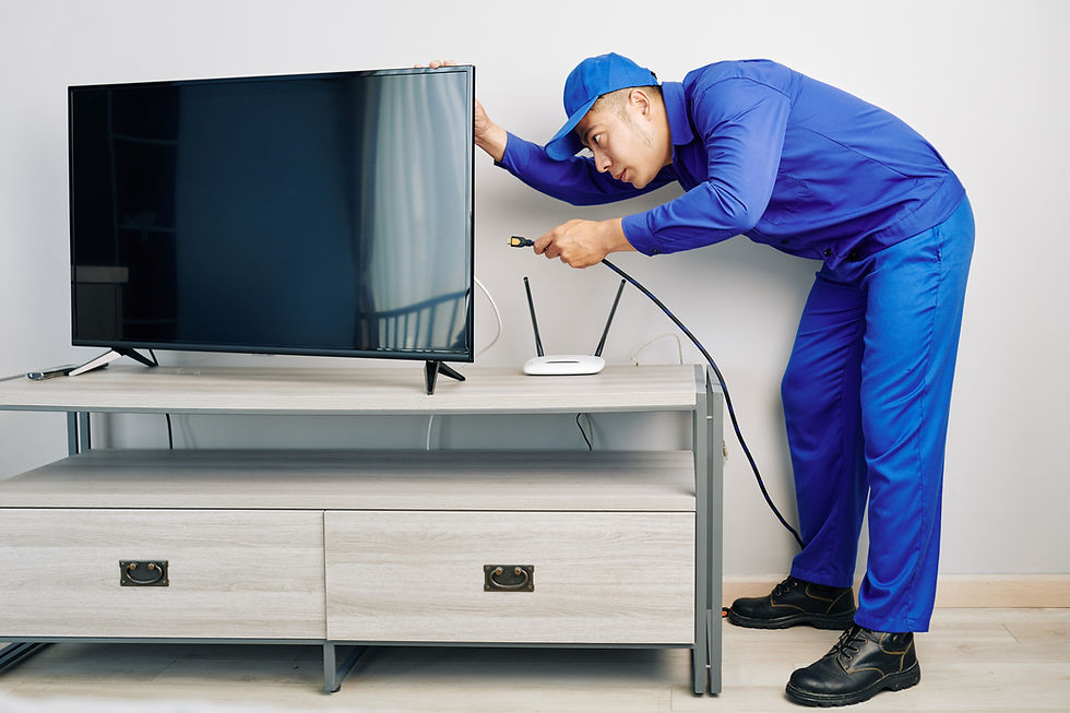 repairman-installing-tv-set.jpg