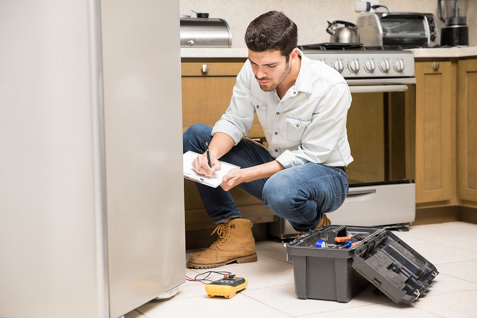 portrait-handsome-male-technician-doing-work-report-broken-fridge-home-kitchen.jpg