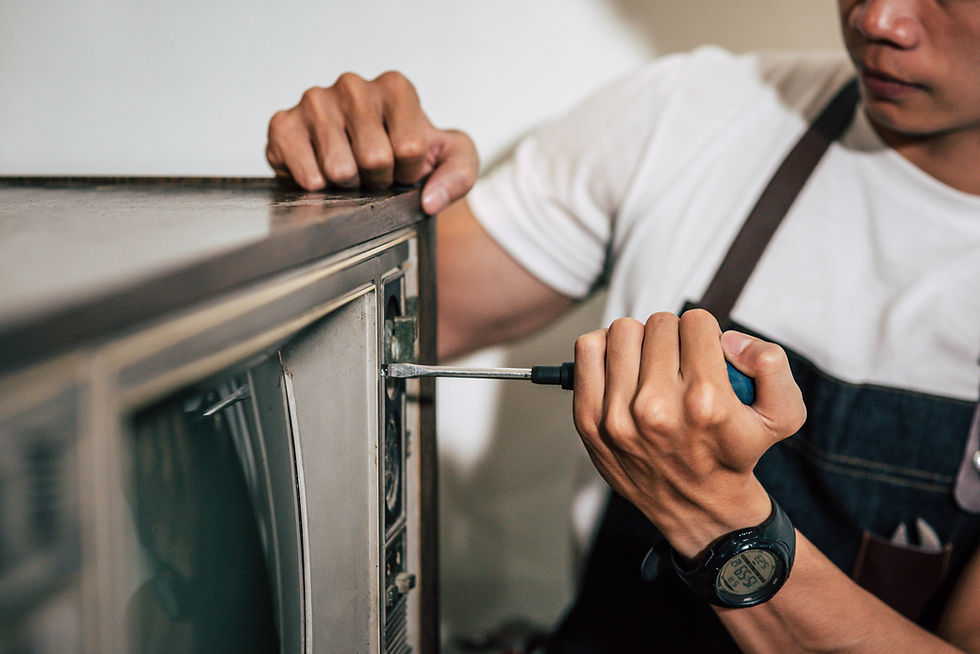 mechanic-uses-screwdriver-tighten-screws-tv.jpg